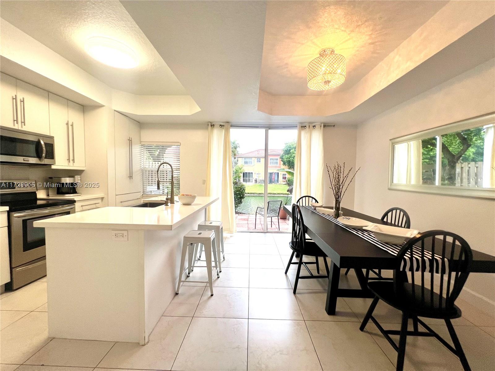 Beautiful waterfront townhome within the exclusive The Villas of Harbor Isles in Dania Beach. This upgraded 2 bedrooms, 2.5 bath in a gated community is just for you! Sliding door to brick-paved back patio overlooks the canal with great space for entertaining. Newer appliances, tile on the main floor and wood floors on the 2nd, where you retrieve to the bedrooms. Walk-in closets and full bathrooms in both bedrooms. One assigned parking spot and sufficient unassigned guest parking near front door of home. Amenities include pool, spa, outdoor gym, 2 children's play area. AC + Water Heater: Original; Minutes from Ft. Lauderdale Airport, and Port Everglades, beaches, and Dania Pointe!