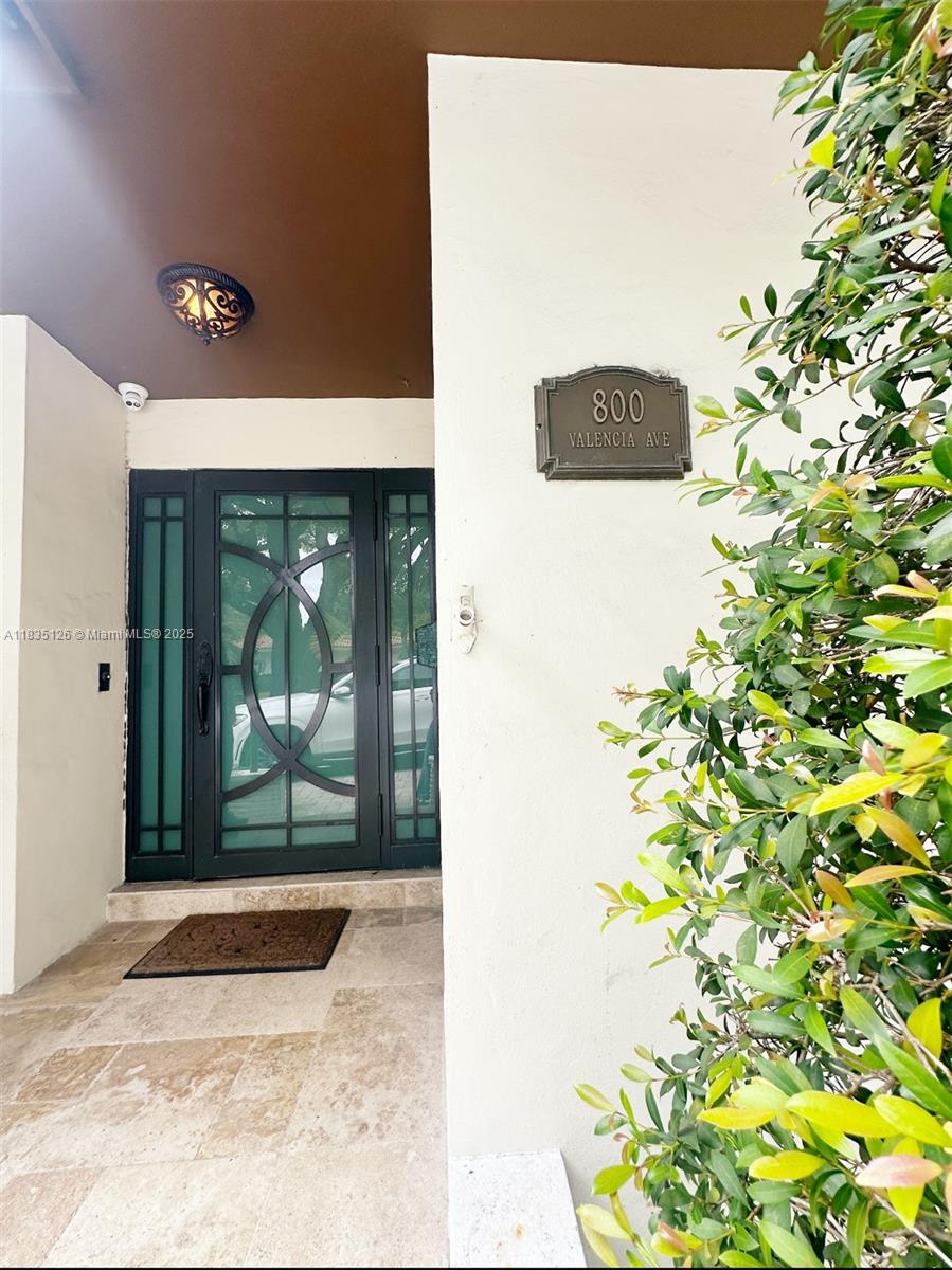 Stunning one-story corner home on a rare 9,990 SF lot in prime Coral Gables. Fully remodeled with impact windows/doors, Italian porcelain floors, and a sleek open kitchen featuring quartz countertops and premium appliances. Spacious 2-bed/2-bath layout with custom closets and modern finishes throughout. Enjoy indoor-outdoor living with a screened terrace, large yard, and room to entertain. Newer roof & A/C. Two-car garage + circular driveway. Just minutes from Miracle Mile, top-rated schools, and all Gables amenities. Move-in ready! Only available for a rental period of up to 6 months.