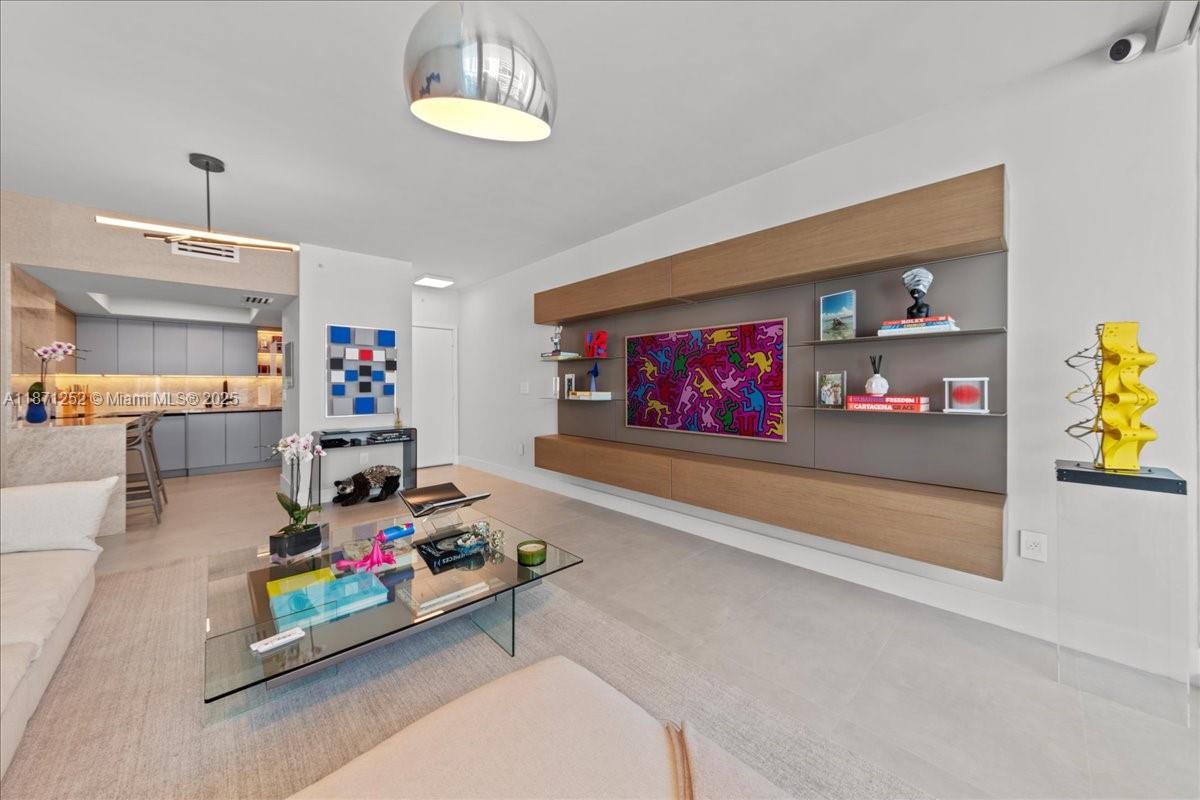 Completely Renovated Jade Brickell Residence with exquisite detail & high-end finishes. Features include a gourmet kitchen with Gaggenau appliances, convection oven, sous vide, & custom lacquered cabinetry. Imported Spanish porcelain floors, spa-inspired bathroom with floating tub, Hansgrohe fixtures, dual sinks, & floor-to-ceiling tile. Additional upgrades include a brand-new 2025 AC, electric blinds, custom closets with wine room, designer wallpaper, solid-core doors, stacked washer/dryer & a private storage unit. Jade Residence features an enormous fitness center, infinity-edge pool, spa, business center, and so much more. Located on Brickell Bay near world-class shopping, dining, & entertainment. This is more than a home; it’s a masterpiece of style & comfort waiting to be experienced