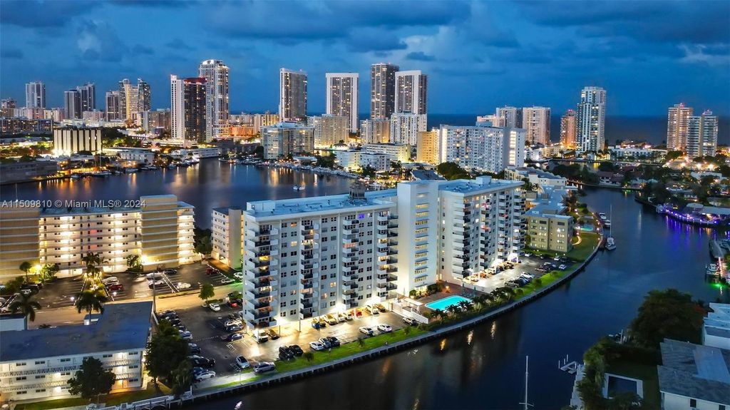 Photo of 401 Golden Isles Dr #409, Hallandale Beach, FL 33009 (MLS # A11509810)