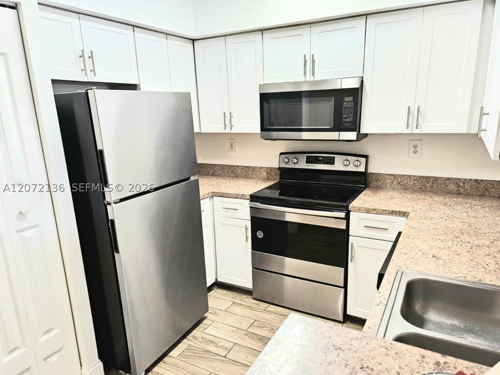 Photo of 220 SW 116th Ave #15105, Pembroke Pines, FL 33025 (MLS # A12072136)