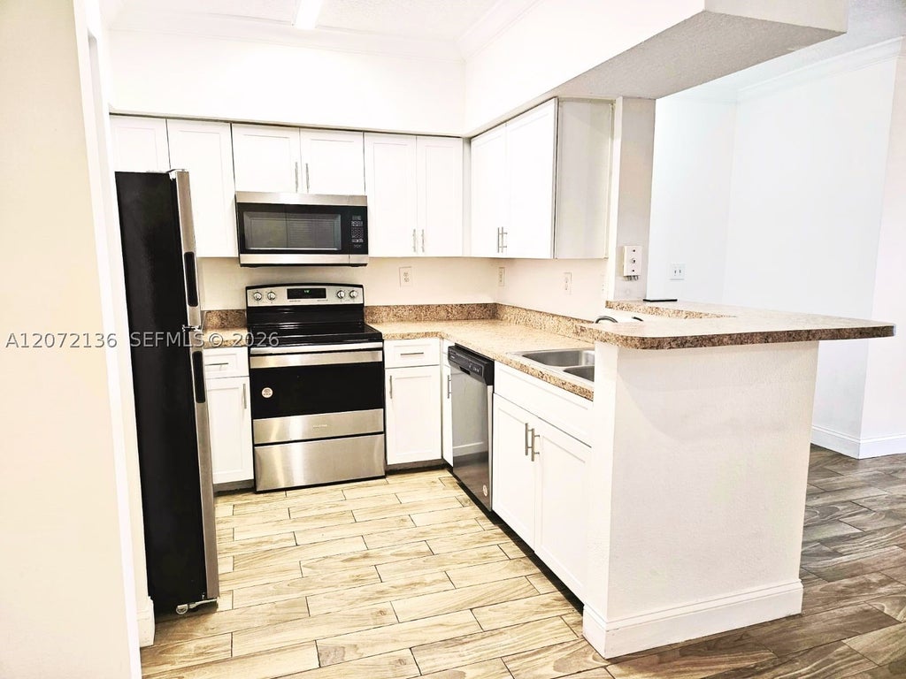 Photo of 220 SW 116th Ave #15105, Pembroke Pines, FL 33025 (MLS # A12072136)