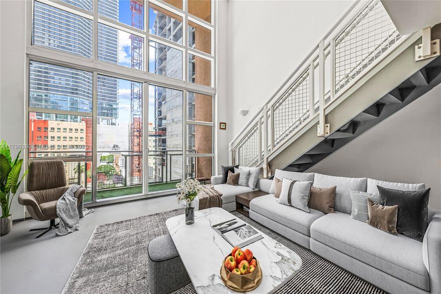 Experience elevated urban living in this exceptional 2-story loft at Vizcayne North Tower. This 978 sq ft residence features soaring 20-ft floor-to-ceiling hurricane impact windows, a balcony, concrete floors, and in-unit washer/dryer. The open lower level includes a half bath, ideal for entertaining. Upstairs offers a spacious bedroom, full bath, and walk-in closet. Residents enjoy one of Miami’s largest resort-style pool decks with multiple bay-view pools, a full-service spa, fitness center, steam room, sauna, movie theater, and club rooms. Prime location with easy access to I95 and across from Bayfront Park, just steps to downtown’s top event venues, Bayside Marketplace, the Metromover, and more. Move-in ready and ideal for end users or investors alike.