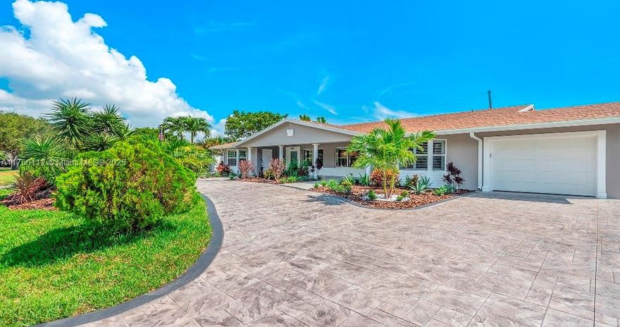 EXTRAORDINARY FULLY FURNISHED AIRBNB! 10% CAP RATE, 6.7% Huge 3,057 sqft Duplex. Fully renovated 2022: Airbnb furnished, newer roof, central air, new electric panels, LED lighting, impact windows/doors, new SS appliances, smooth walls, stamped driveway, A/C in garage, bathrooms, patio decks, grills, PVC fence, Alexa, Sonos, 120v landscape lighting, Ring alarm, 8-camera surveillance, fully equipped kitchens, Schlage keyless entry, walk-in closets, flat screens, Keurig coffee makers & more! Double insulated roofs, Italian patio furniture. Keep as duplex with 2-3/2 units or convert to 4 units of 2-2/1 & 2-1/1 studios. Fully licensed short-term rentals, proof of income available. Earn 150k per year as 2 Airbnbs, or split into 4 Airbnbs, potentially earning up to 200k.