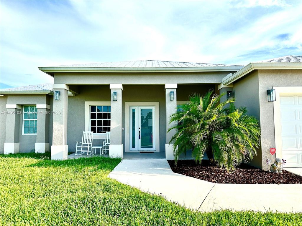 Photo of 1222 SW Herald Rd, Port Saint Lucie, FL 34953 (MLS # A11435103)