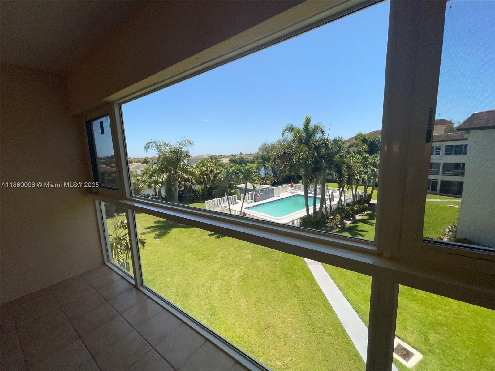 New White Range! Stunning 1-Bedroom, 1.5-Bath Unit with Direct Pool Views! Enjoy serene pool views through brand-new, hurricane-impact panoramic windows in this spacious, beautifully updated unit. Features a remodeled kitchen and includes one assigned parking space. Don't miss this incredible opportunity at a great price!