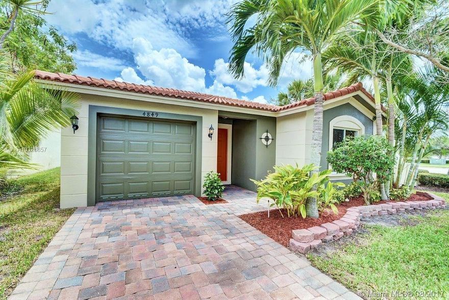 Beautiful 3 BR 2 BA Eaton model in the desirable community of Martin's Crossing. Most affordable home in the neighborhood!  Well maintained and freshly painted inside and out, new flooring, clean and ready for new ownership. Features open kitchen, breakfast bar, wood cabinets, granite, SS appliances, split floorplan, real bamboo wood flooring, ceramic tile, new carpet, vaulted ceilings, and open patio with water views. Amenities include club house, resort-style heated pool & cabana, gym, tennis courts, playground and rover security. Close to community pool. Community is centrally located and convenient to A+ rated schools, shopping, I95 & Turnpike. A must see! All measurements are approximate.