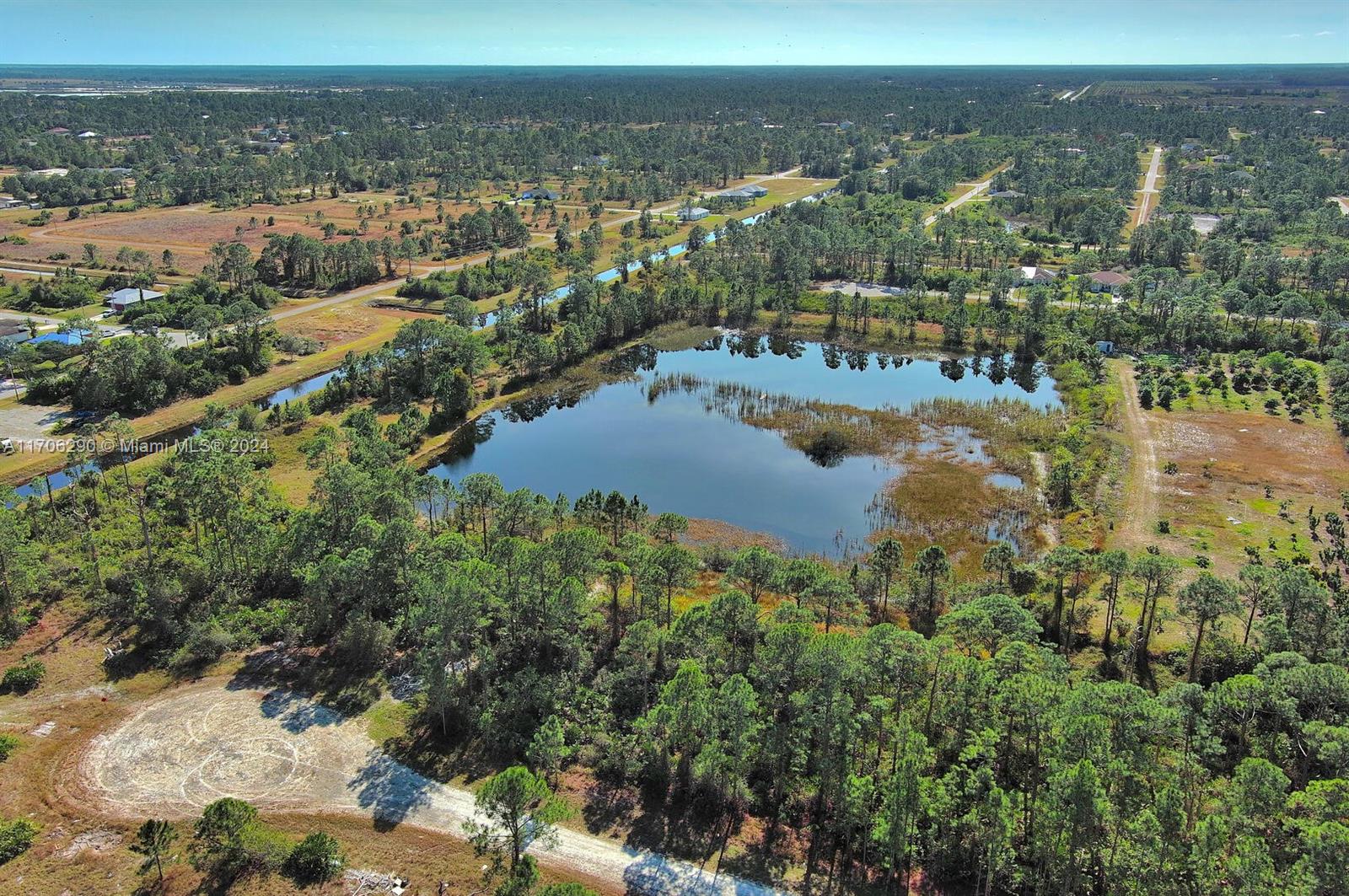 Exclusively offered by Sunland Real Estate: premium 0.23-acre residential lot on a pond, in south Lehigh Acres, perfectly positioned for your next development. This prime property boasts a high and dry elevation, ensuring it's completely outside flood zones and ideal for building with confidence. Conveniently located near major boulevards, this lot provides direct access to the town center, making it a fantastic choice for those seeking convenience and growth potential. Lehigh Acres is a thriving Southwest Florida community celebrated for its affordable land, welcoming neighborhoods, and excellent location near Fort Myers. Enjoy quick access to shopping, dining, and the breathtaking Gulf Coast beaches. Don’t miss this opportunity to invest in one of the region’s most promising areas.