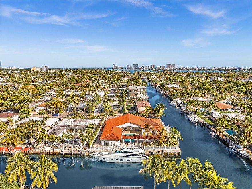 Bring your super yachts! This rare waterfront estate in Gated Keystone Point sits on a 15,504 SF corner lot with 250 FT on the water. Two docks (136 FT & 114 FT) provide room for two 100+ FT yachts in a deep-water canal w/ direct ocean access & no fixed bridges. This spacious 4BD/5BA home features newer white porcelain floors, large primary suite w/ expansive en-suite bath & French doors in every room opening to the pool for seamless indoor-outdoor living. Move-in ready w/ remodeled baths, built-in closets. Large bright and light open kitchen. Resort-style backyard boasts a pool, large patio decks, & covered outdoor kitchen. Seawall upgraded w/ batter piles & new cap, plus a new dock—a boater’s dream! electric gate, 2-car garage, prime location. A True one-of-a-kind waterfront opportunity!