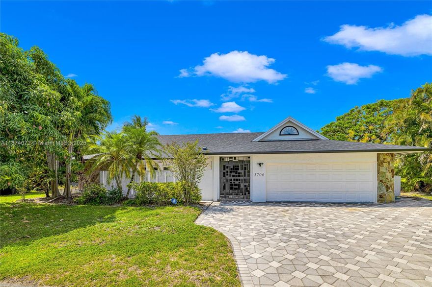 Freshly remodeled home on a quaint cul-de-sac, located in the the desirable "Woodlands". The 4-BR home features an ideal living configuration for families w/ open concept living in the common spaces & a desirable split layout for the living quarters. The living room, family room, & kitchen communicate seamlessly with the outdoor, screened-in pool area. The large pool patio enjoys peaceful views of a nearby lake. The kitchen space has ben remodeled substantially to enhance the modern look & feel of the interiors. All bathrooms have also been upgraded w/ a contemporary sensibility. Additionally, the home features a designated laundry room area which connects to the large two-car garage. Woodlands is a well-maintained community w/ approximately 890 homes; Perhaps Broward's best kept secret.