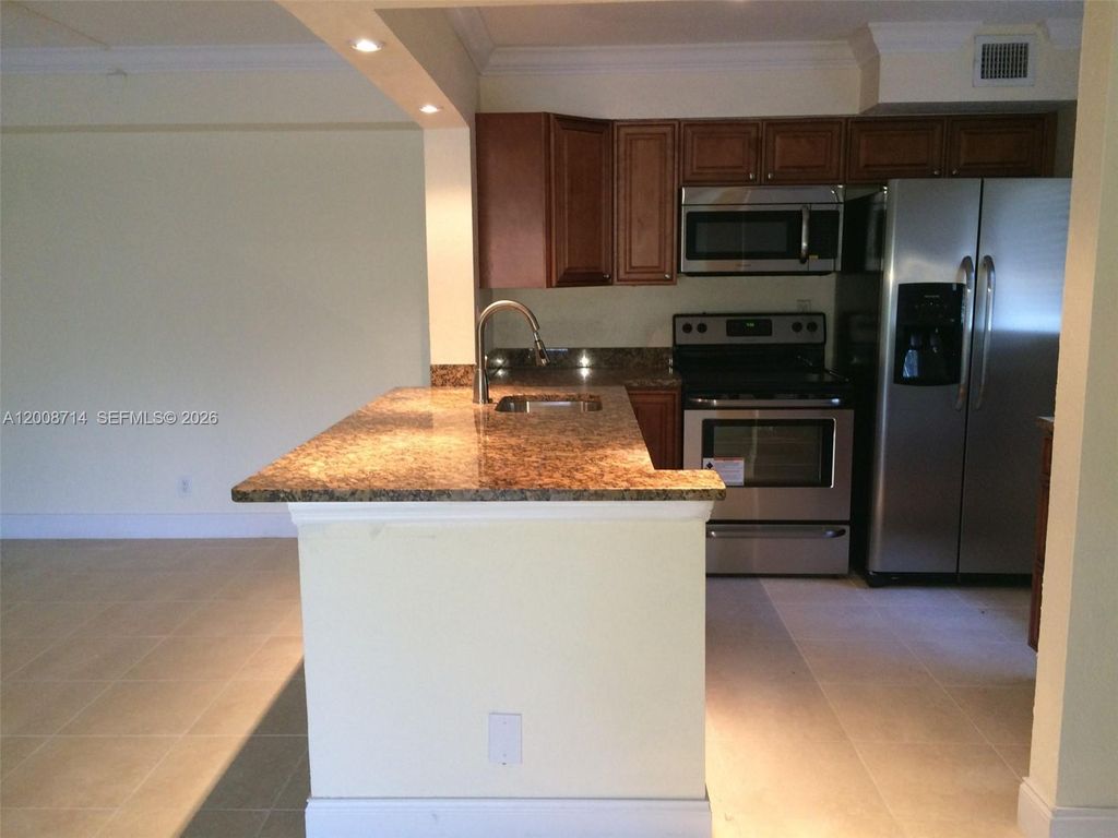 Photo of 407 Gardens Dr #103, Pompano Beach, FL 33069 (MLS # A12008714)