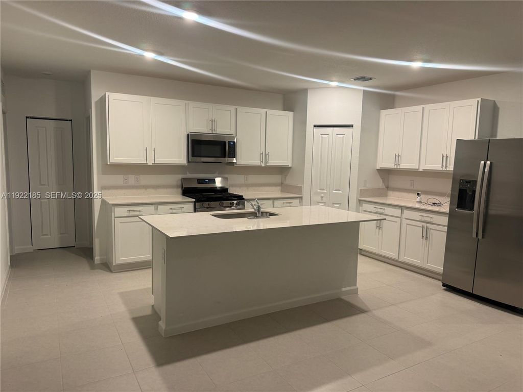 Photo of 5885 NW Sweetwood Dr, Port St Lucie, FL 34987 (MLS # A11922185)