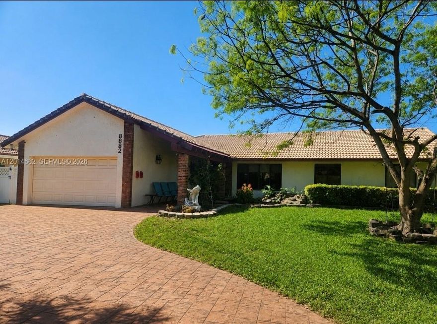 NO HOA! Make this home your own!!! Come tour this open & spacious Shadow Wood home in the heart of Coral Springs. Welcoming front entrance area with decorative water. Newly remodeled, large, gourmet kitchen with HUGE center Island, & stainless appliances. Family room, formal dining area and separate living room. 4 bedrooms on one side. All baths have been remodeled. Interior Laundry room with sink, garage has extra storage, 2 ac units-duct work redone 2016, water heater 2024. Impact windows, 2 car garage. and large circular driveway.  Large patio in back with big covered area, perfect for entertaining. Hot tub, pergula and shed. Enjoy your water/canal view & No back neighbors, private, fully fenced yard. and refreshing pool. Close to the park  Well maintained neighborhood with gorgeous, mature trees.  Coral Springs schools. Close to shopping, restaurants and major roads. Home needs TLC!!