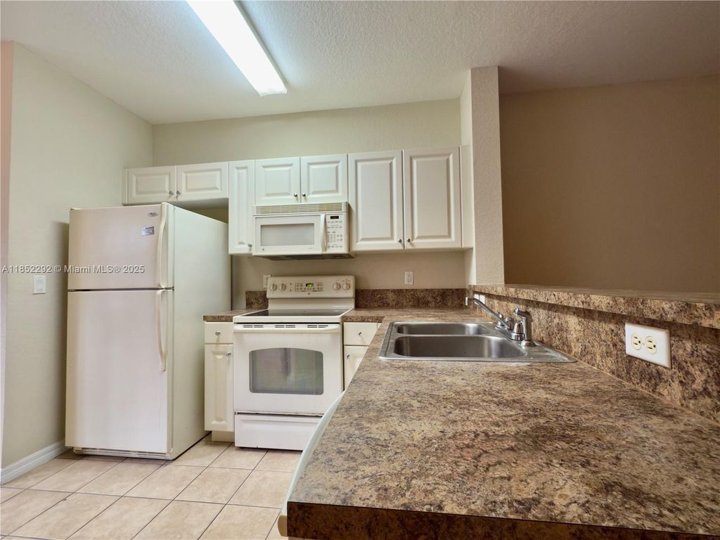 Photo of 1904 Alamanda Way #1904, Riviera Beach, FL 33404 (MLS # A11852292)