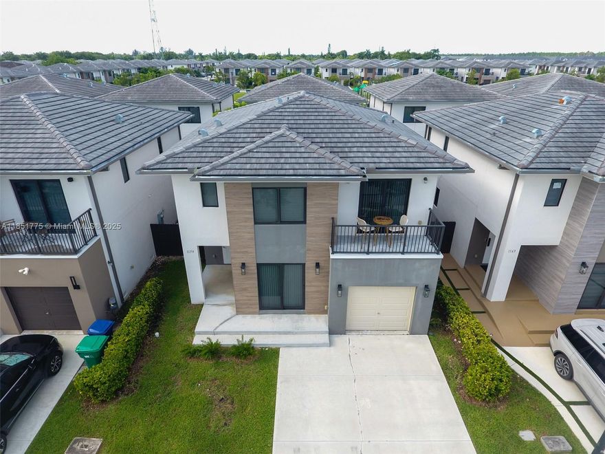 This home qualifies for Florida Hometown Heroes Program. Modern 5-Bed / 4.5-Bath – Florida City
Built in 2023, this stylish 2-story concrete home offers 5 spacious bedrooms and 4.5 baths, including a first-floor guest suite with private entrance—ideal for family, visitors, or rental income.
Features include:
Open kitchen with stainless steel appliances & stone countertops
Porcelain tile floors, impact windows & doors
Large primary suite with balcony, walk-in closet & double vanity bath
Full-size washer/dryer
Garage + driveway for up to 4 cars
Fenced backyard with covered patio
Located in a welcoming community, this home blends comfort, function, and opportunity.
All information deemed reliable but not guaranteed.