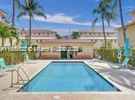 Cozy Renovated Townhouse with 3 bed and 2 &1/2 baths a charming Mediterranean-style boutique community in North Miami Beach. This move-in ready home features a brand-new kitchen with modern countertops, new appliances, remodeled bathrooms, and a newer AC unit. Freshly painted and equipped with an in-unit washer and dryer, this townhouse offers comfort and convenience.One parking soace Modern countertops and brand-new appliances