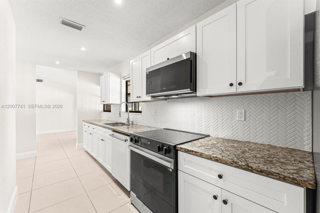 Photo of 18055 W Sycamore Dr #1, Loxahatchee, FL 33470 (MLS # A12007741)