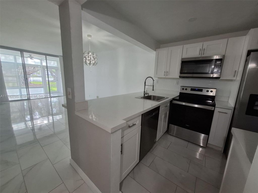 Photo of 9430 Poinciana Pl #109, Davie, FL 33324 (MLS # A11782785)