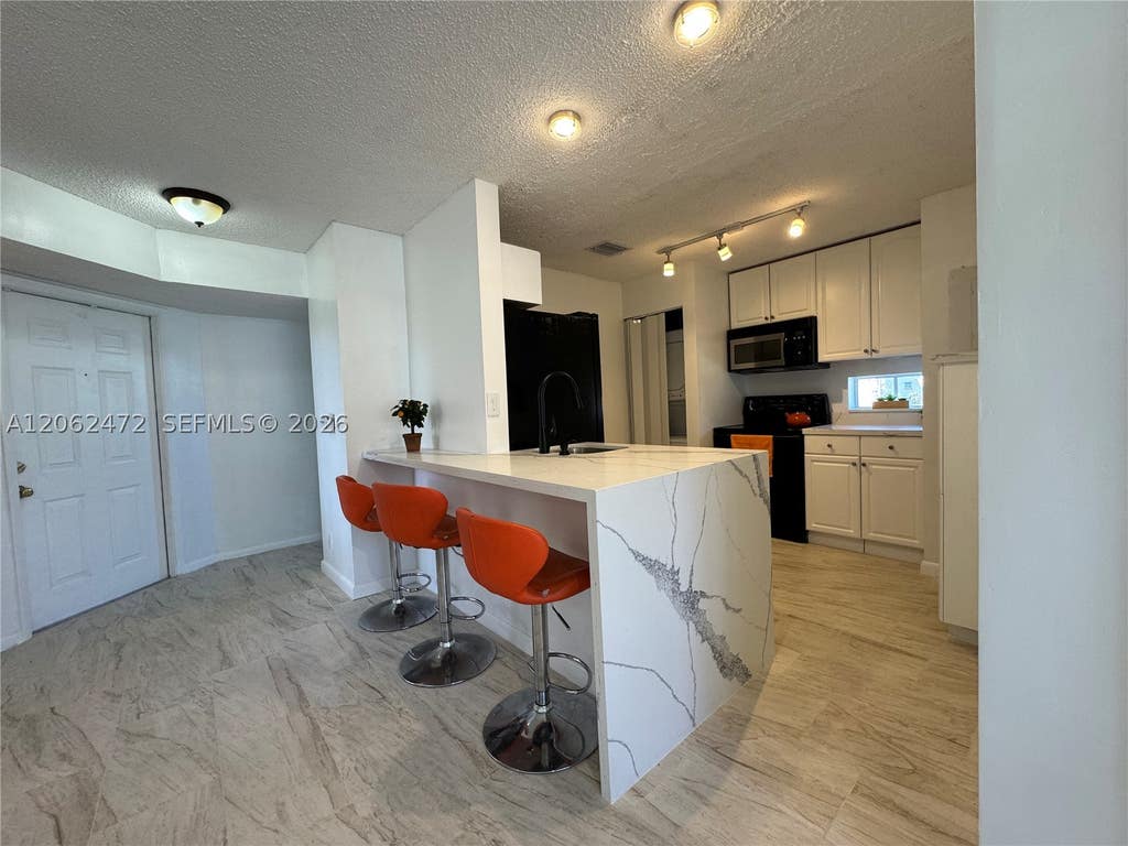 Photo of 8630 SW 3rd St #101, Pembroke Pines, FL 33025 (MLS # A12062472)