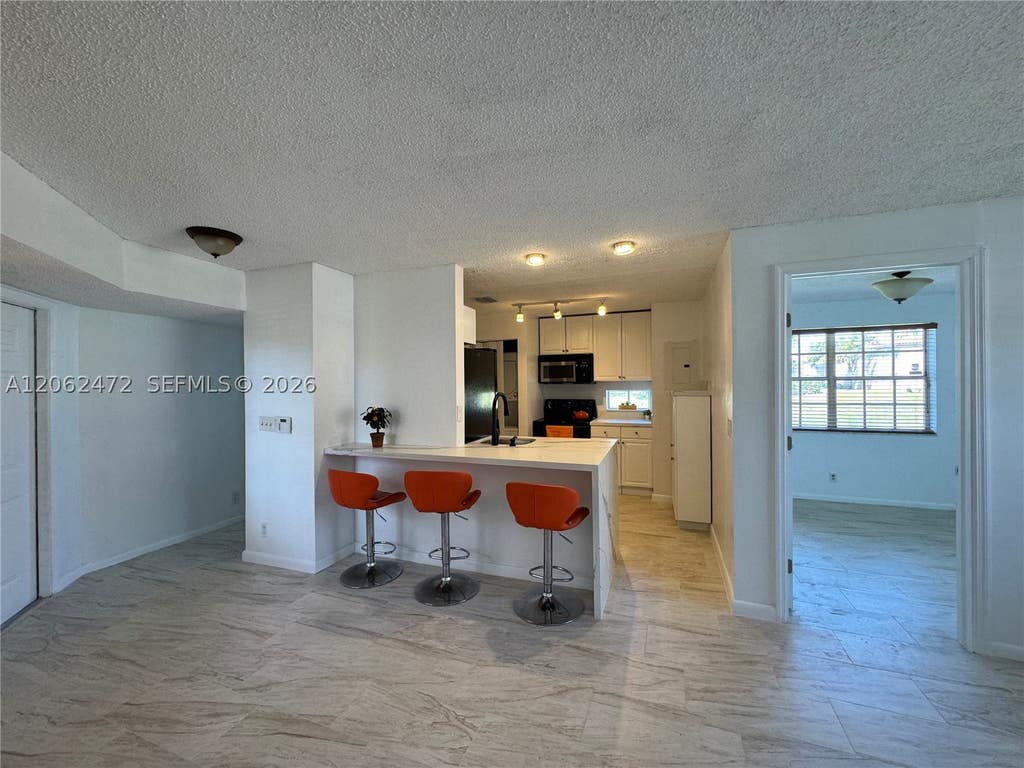 Photo of 8630 SW 3rd St #101, Pembroke Pines, FL 33025 (MLS # A12062472)