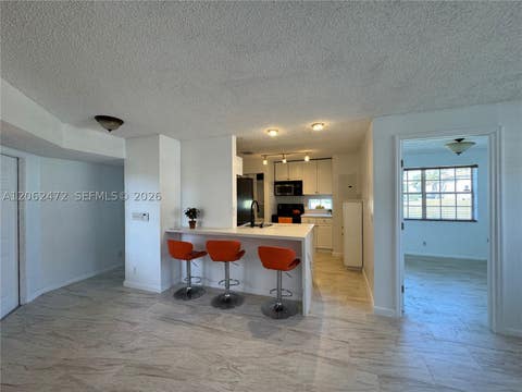 Photo of 8630 SW 3rd St #101, Pembroke Pines, FL 33025 (MLS # A12062472)