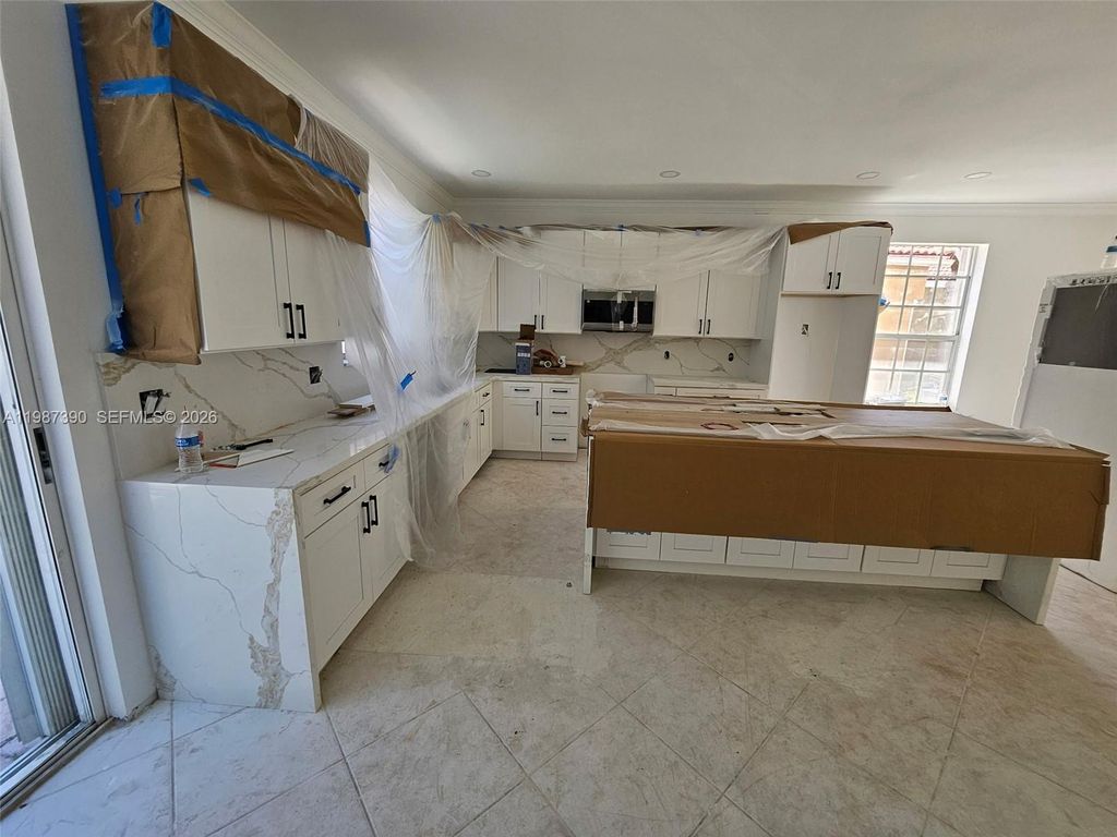 Photo of 12425 NW 54th Ct, Coral Springs, FL 33076 (MLS # A11987390)