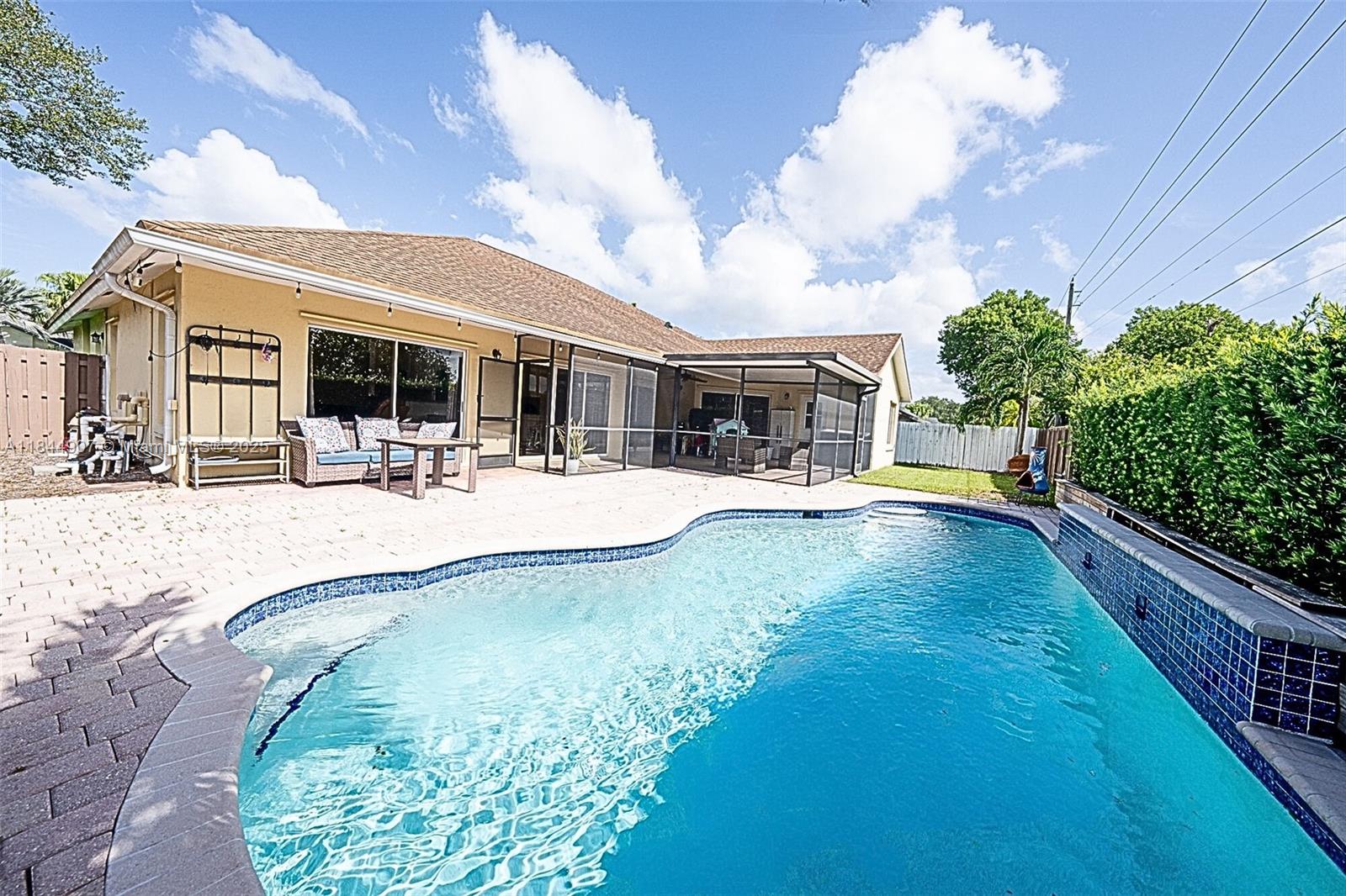 Come see this beautifully-upgraded 4/2 pool home in a family-friendly neighborhood of New River Estates zoned for top-rated schools on the "excellent" list. Features soaring vaulted ceilings, open-concept remodeled kitchen with granite countertops and SS appliances. You will love the stylishly renovated bathrooms! Enjoy a private pool and spacious screened-in porch in fully fenced yard. No rear neighbors- just direct gated access to sidewalk behind the property. No HOA approval needed. Two-car garage w/epoxy floors and thermal barrier padding on door for climate control. Minutes from Sunset Park, Sawgrass Sanctuary, and Weston Town Center, Family Farms, and walking trails. Great suburban area that offers tranquility combined with accessibility. FEMA X zone.