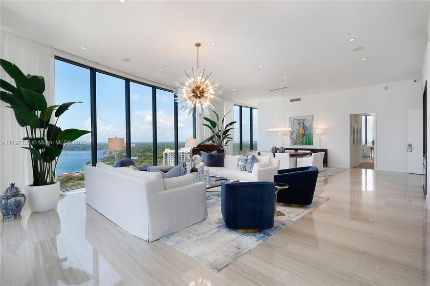 Located in Park Grove Condominiums, this rare Upper Penthouse sets a new bar for luxury hi-rise living in Miami. Featuring soaring 12’ ceilings, natural light throughout and deep, shade covered patios, this penthouse offers 270 degrees of panorama views of Biscayne Bay and Coconut Grove. The kitchen features custom Italcraft cabinetry with bespoke finishes and a large family room. The main living room is designed for entertaining guests inside and out. The master suite has two walk-in closets, exercise room, oversized tub, steam sauna, his/her vanities and private home office. The defining feature of this penthouse is the private, 4,000+ sf rooftop level complete with pool, heated spa, summer kitchen, cabana and bath. Add’l amenities include laundry, storage and 2 parking spaces.