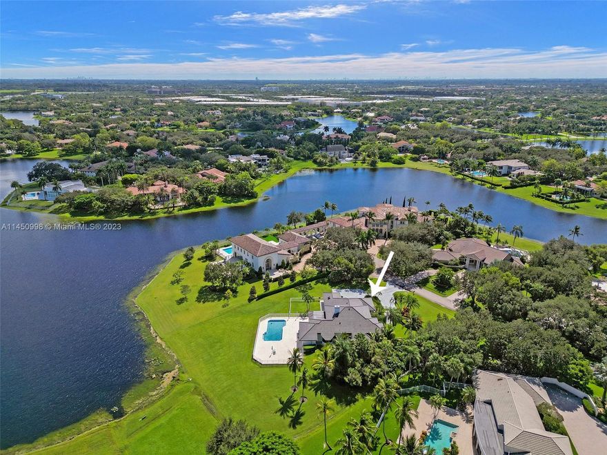 This gorgeous home is in THE most exclusive community in Windmill Ranch Estates, in Weston!!!.. 5 Bedroom/4 Bathroom Pool home is situated on a 1.29 Acre lot overlooking a beautiful glistening lake on a cup-de-sac!  Come tour this bright, expansive single story home, with volume ceilings and glass everywhere to enjoy the panoramic water views with lots of natural light. Relax with the entire family in the 336 sqft covered, screened-in patio overlooking the 2,800 sqft pool deck. This expansive home has so many extras!....New roof(2021), gutters, water heater, 2 new A/C's(2022), LED lighting throughout. Looking for the best schools?....Weston is your answer!!!