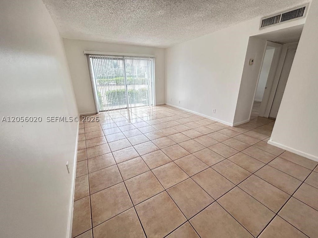 Photo of 3212 Coral Ridge Dr #3212, Coral Springs, FL 33065 (MLS # A12056020)