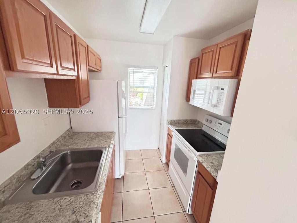 Photo of 3212 Coral Ridge Dr #3212, Coral Springs, FL 33065 (MLS # A12056020)