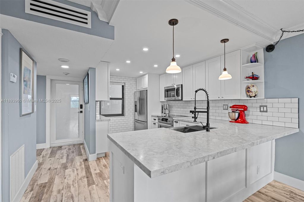 Photo of 1401 N Riverside Dr #604, Pompano Beach, FL 33062 (MLS # A11893960)