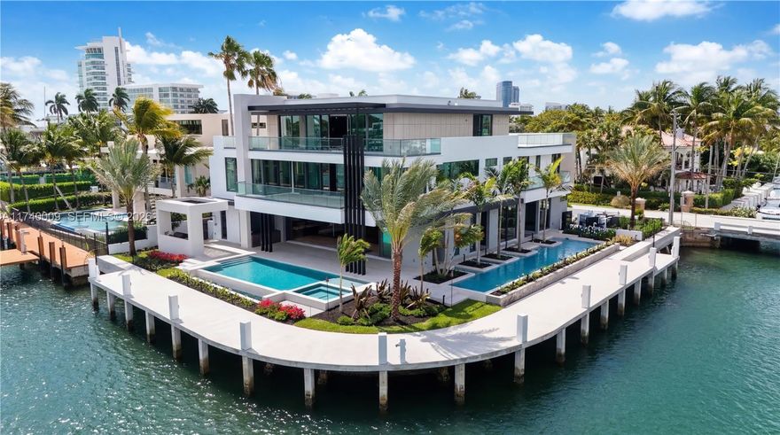 Set on a coveted point lot in the exclusive Harbor Beach enclave, this modern estate represents a premium tier of renowned luxury. The rare East Point location offers 250+/- ft of deep-water dockage for large yachts or multiple vessels, with commanding Lake Sylvan & downtown skyline views. Boasting exquisite Italian finishes across three levels, this residence features 7 bedrooms, a wellness center/gym, executive office, & rooftop lounge with custom bar. Enjoy ultimate entertainment with a media room, game room, & expansive wrap-around terrace. Outside awaits a secluded resort oasis with multiple pools, a hot/cold plunge, sauna, steam showers, & summer kitchen with bar, dining, waterfalls, & fire features. Poised for completion April 2026. Schedule a tour today!