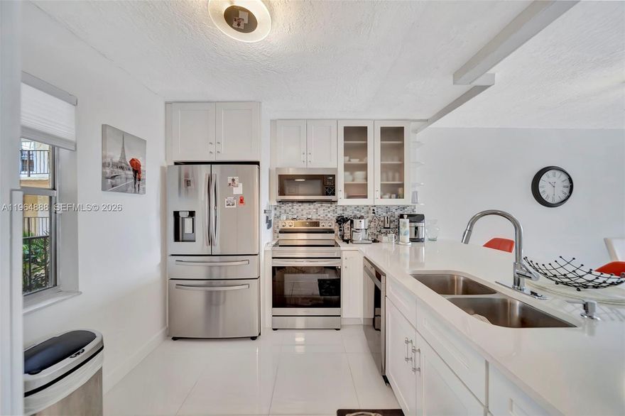 TURNKEY - FULLY FURNISHED. This beautifully renovated 2-bedroom, 2-bath condo offers the perfect blend of style, comfort, and convenience. Thoughtfully updated from top to bottom, the home features modern finishes and a clean, cohesive design throughout. Elegant tile flooring runs seamlessly across the entire unit, creating a bright and polished feel. The open-concept layout makes everyday living and entertaining effortless, connecting the spacious living room to the dining area, upgraded kitchen, and enclosed balcony for added versatility. The kitchen is truly a “standout”, complete with SMART appliances, custom cabinetry, and sleek contemporary fixtures that elevate the space. Both bedrooms are generously sized and feature HUGE walk-in closets. The well-maintained and active community provides resort-style amenities including a fitness center, sparkling pool, clubhouse, BBQ Courtyard and scenic walking paths. Centrally located near shopping, dining, and major highways, this condo delivers both lifestyle and convenience in one exceptional package. ASSESSMENTS PAID. ROOF 2025. NEWER AC AND WATER HEATER, PRIVATE STORAGE. ASSIGNED PARKING, PLENTY OF GUEST PARKING, SIRS REPORT COMPLETED.