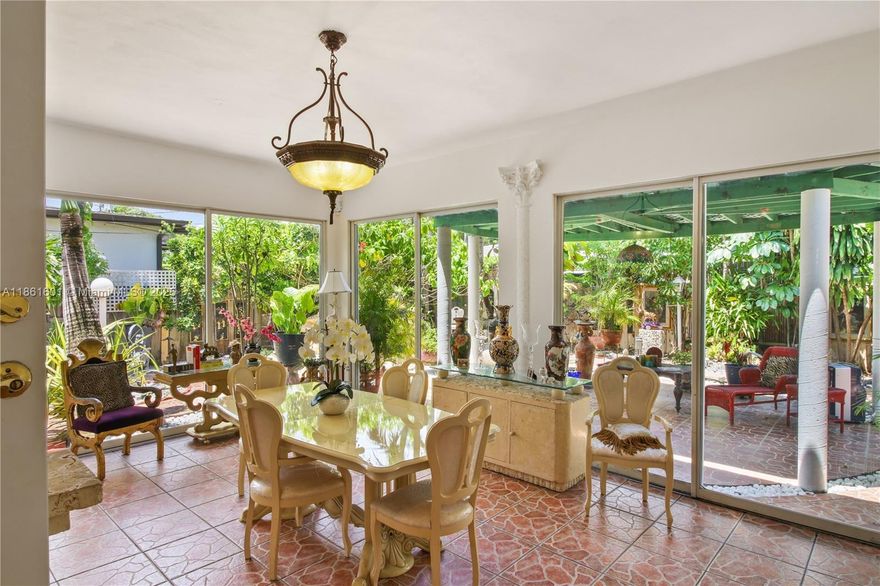 Welcome to Casa Rosablanca in the heart of sought-after West Miami! This light-filled 2 bed, 2 bath home includes a versatile Office/Den/Baby Room, Large Living Room, Formal Dining, Eat-In Kitchen, and a Florida Room with floor-to-ceiling sliders overlooking the lush patio garden—perfect for entertaining or converting to a primary suite. The 1,620 sq ft layout feels spacious and artistic throughout. Enjoy a gated lot with carport, multiple parking spaces, mature landscaping, avocado tree, gazebo, fountain, and storage shed. Roof 2018. Located in a vibrant community near Cooper Park, with year-round events, dancing, kids' activities, and its own farmers’ market—this home embodies the charm and lifestyle of Miami living!