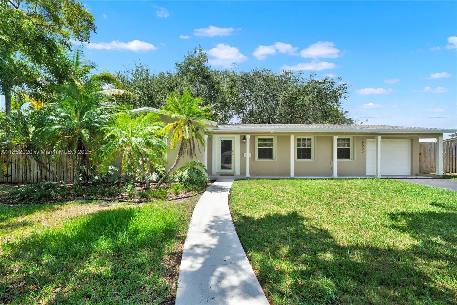 Fully Renovated Gem in Prime Location! Discover this upgraded 2-bed, 1-bath home with versatile spaces including a flex room ideal for a studio, guest suite, or office. Enjoy a stunning impact glass-enclosed patio w/AC overlooking a private, fenced garden oasis filled with mature oaks & lush landscaping. The new sleek kitchen features floor-to-ceiling cabinetry, smart appliances, and a large SS sink. Gleaming terrazo floors, crown molding, recessed lighting & sun-filled windows throughout elevate the interior. Spacious laundry rm with LG front-load washer/dryer. Professionally landscaped front & back yards *Well & sprinkler system* Located in a flood-free zone with easy access to parks, shopping, dining, golf, Metro & more. Hurricane protection throughout. A rare find—don’t miss it!!!