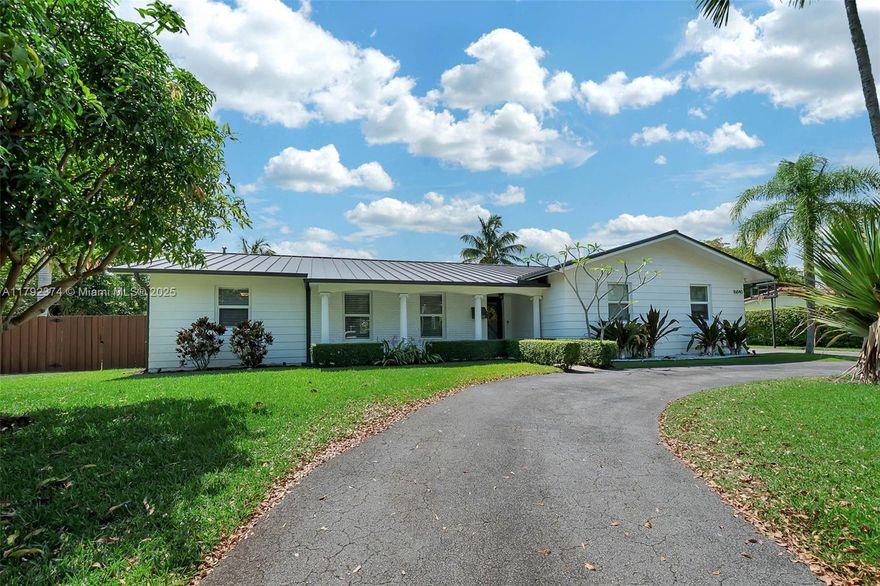 Canalfront, 4 bdrm/ 2 bath updated home in Palmetto Bay. Open concept living area, dining with butler’s pantry. Gorgeous, remodeled kitchen with quartz countertops, beautiful cabinetry, tile backsplash in herringbone design, center island and seating, beverage cooler. Family room w stone fireplace, currently used as 4th bedroom. Well-distributed guest bedrooms, new guest bath with artistic tile flooring, double sinks. Primary bdrm w/ serene pool views, glass enclosed shower, walk-in closet. Plank tile flooring in living areas, carpet flooring in bdrms. Impact glass windows/ doors. Metal roof. Fenced yard, screened-in pool with beach entry and modern, stone patio. Circular drive, 2 car garage with side entry.