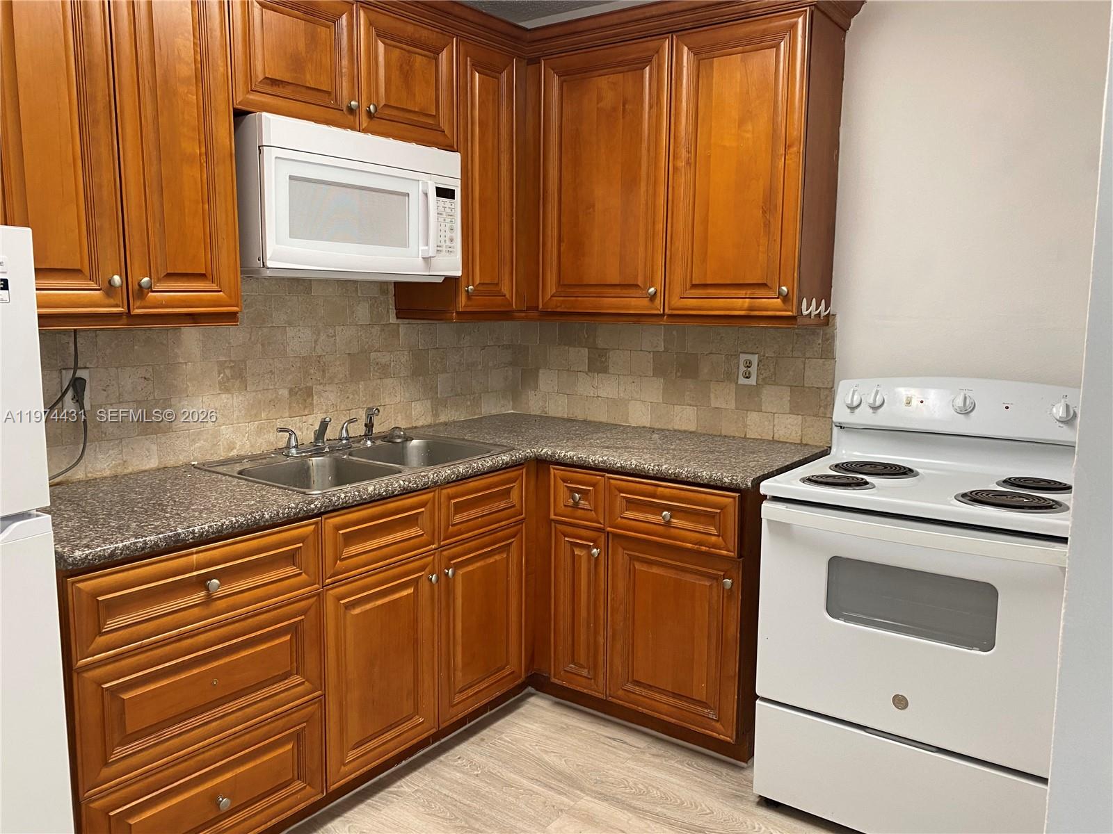 GARSAN APTS INC CONDO - Residential Lease