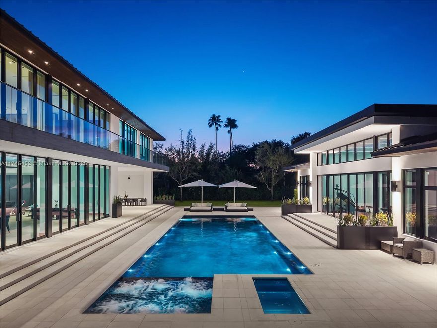 Rare luxury estate with 2 acres of land in the heart of Pinecrest! Newly built in 2022, with 20,182 sq ft. of open plan living, a refined modern residence featuring double height ceiling central atrium with spectacular circular staircase, 10 beds with large en-suite bathrooms and spacious closets, 4-car garage, elevator, large master suite with en-suite living area overlooking atrium with 725 sq foot skylight! Interior and exterior water features, custom Italian kitchen and closet millwork, large marble slabs line the foyer, and floor to ceiling windows throughout. Expansive grounds surround the pool deck, jacuzzi, cold plunge, a detached 1000 sq foot gym, and tennis court. Very large backyard with room for a padel or pickle ball court, basketball court, soccer field or a putting green!
