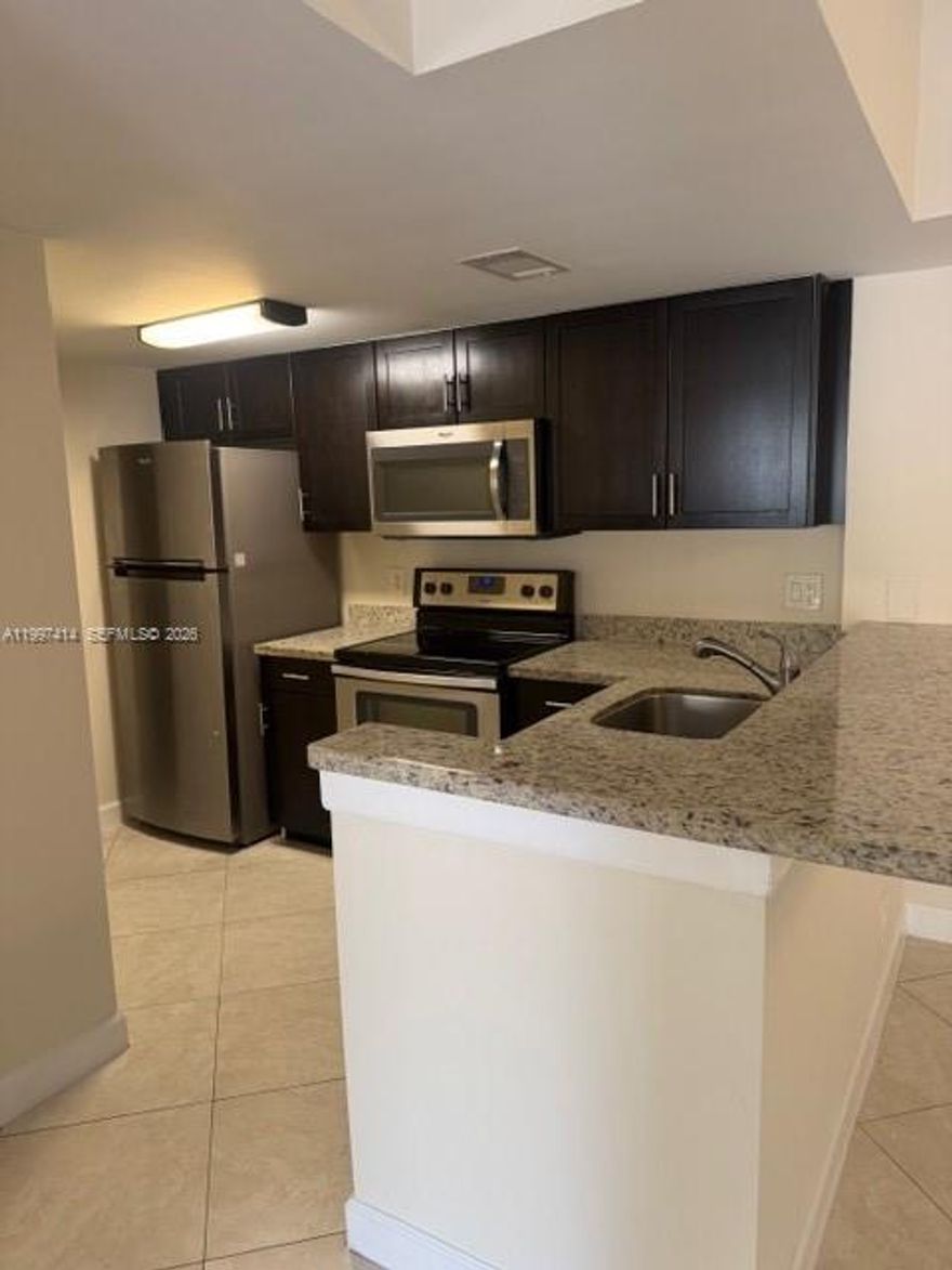 Discover exceptional value in this updated 2 BD, 2 BA corner unit nestled within Lakes of Jacaranda. At 965 sqft, this condo delivers style, comfort, & convenience at an unbeatable price point for South Florida living. Step inside to find a fully remodeled kitchen featuring sleek granite countertops, modern cabinetry & stainless steel appliances — a true culinary haven. Enjoy seamless, carpet-free flooring throughout & the added luxury of your own washer & dryer. The corner unit positioning floods the space w/ natural light while offering enhanced privacy. This unit does have poly piping & once closed, the association will give you 60 days to replace the pipes. The location is where this property truly shines. Sunset Park sits just steps away, perfect for morning strolls or afternoon relaxation. Publix at Plantation Promenade is minutes down the road for everyday essentials, while the iconic Sawgrass Mills mall offers world-class shopping & dining nearby. You're also moments from Fort Lauderdale, Hollywood International Airport, Las Olas Boulevard, pristine beaches & legendary entertainment at the Hard Rock. Major highways including 595, I-75, I-95 & Florida's Turnpike place everything within effortless reach. Community amenities rival any resort — two sparkling pools, a heated jacuzzi, lighted tennis courts, a lakefront jogging trail, fitness center, clubhouse & BBQ areas. This pet-friendly community even features a dedicated car care center.