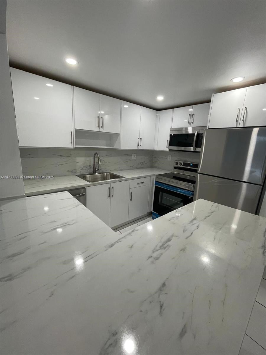 Looking for a clean, comfy spot in a great location? This 1-bedroom, 1-bath condo in North Miami has everything you need! Bright and airy with an open layout, tile floors, and a super functional kitchen—perfect for easy living. The bedroom is spacious, and there’s even a private balcony to unwind and enjoy the fresh air. The building’s got great amenities too—pool, laundry, secure entry, and assigned parking. You’re close to everything: FIU, Barry University, shops, restaurants, and just a quick drive to the beach.