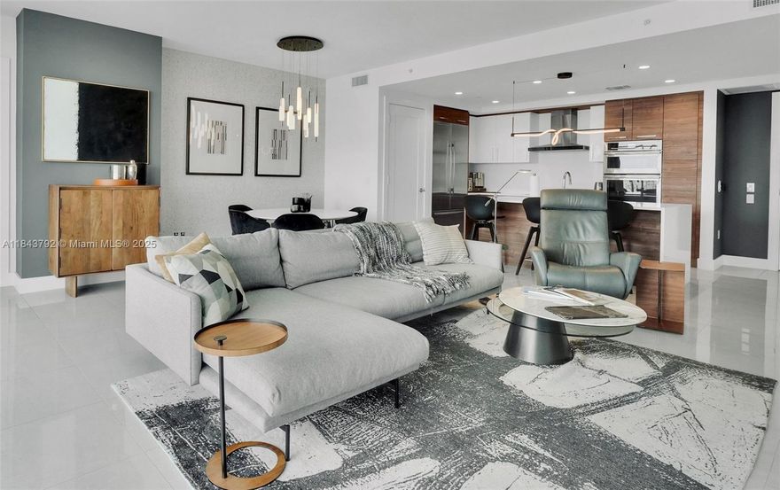 Absolute best downtown address in the heart of Ft.Lauderdale! Breathtaking views featuring 10 foot floor-to-ceiling windows. Split floor plan 2 bed /2.5baths + a large office/den; porcelain floor throughout, all windows feature motorised black out shades. Upgrades includes integrated home automation SONOS system for sound, TV & lighting. Kitchen equipped w Euro cabinetry, Jenn-Air stainless appliances & quartz countertops/backsplash, wine cooler. Bedrooms feature built-in custom closets. Unit sold fully furnished & turn-key! Parking 2 ASSIGNED side by side space, one is which is /EV CHARGING SPACE!. 
Five-star resort-style amenities; rooftop pool, cabanas, fitness center, grills, club room, restaurants, 24hr doorman/security, valet service. Rapid HOA approval. Text Agent for showings