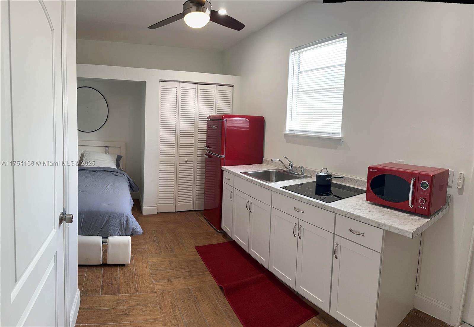 This cozy studio/efficiency is perfectly designed for comfortable living and functionality, it integrates the bedroom with a queen-sized bed and kitchen. The kitchen has essential appliances, including a refrigerator, stovetop, and microwave, providing everything you need to whip up your favorite meals. You'll find a small dining nook featuring a charming table and chair set, perfect for enjoying morning coffee or sharing meals with friends. This studio is fully furnished and ready to move in and make it your own. Perfectly for singles or couples, its design offers a delightful living experience in a convenient location. Schedule a showing today! Minimum score required is 650. No access to the pool or laundry. All utilities included. No pets.