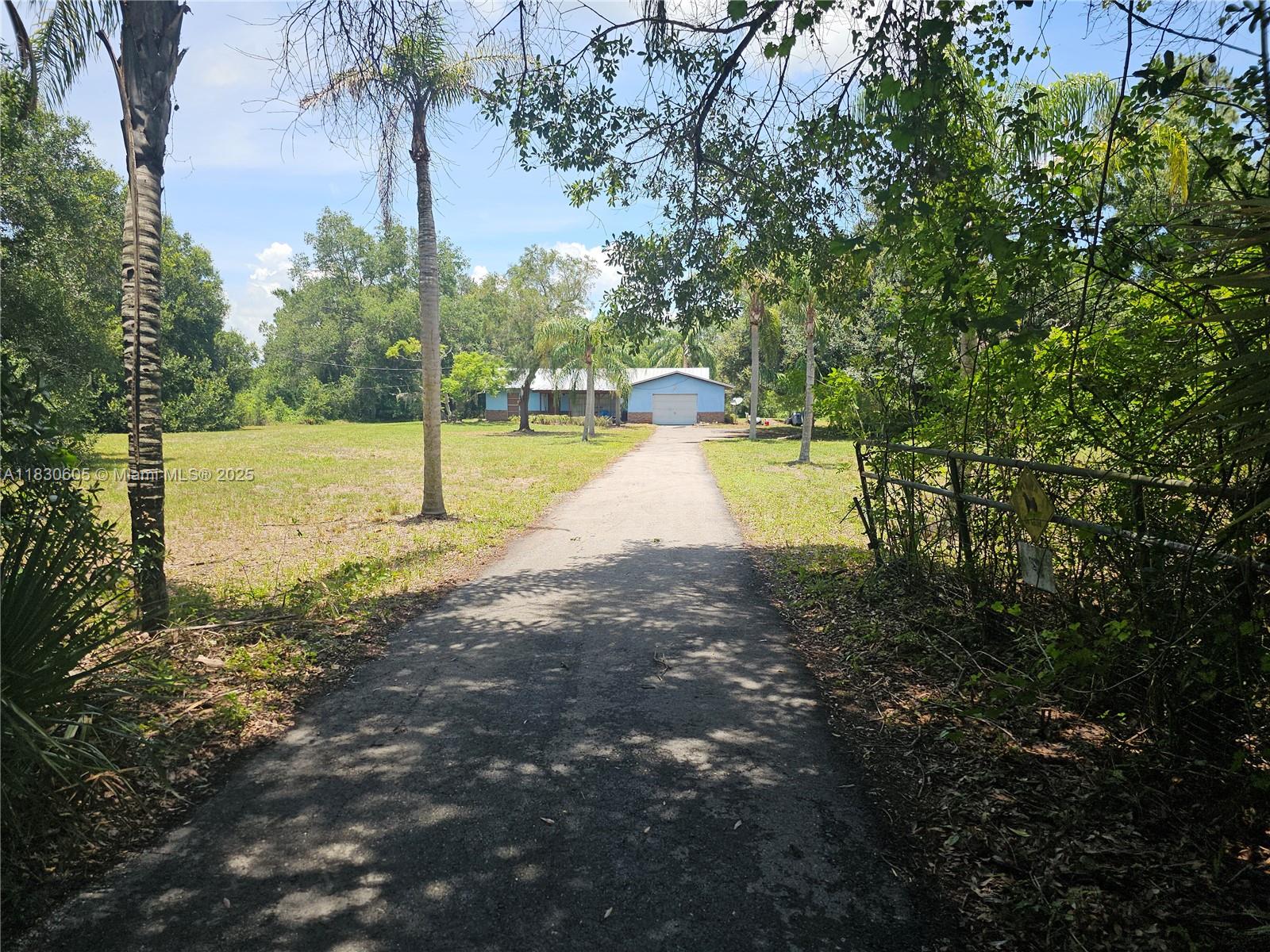 The potential for this property is limitless, allowing for creative possibilities. Experience the tranquility of rural living on 4.57+/- acres in Labelle, Florida, free from deed restrictions. This property presents a unique opportunity to invest in your future by renovating this 3 BR 2Bath home.. Conveniently situated off Helms Rd & SR29. Easy access to SR 80 & downtown business district, Property is being sold "AS IS". Some personal items & furniture in home will be removed prior to closing. All remaining items will be responsibility of new owner to remove. There may also be option to split the acreage into two homesites, confirm with Hendry County for guidance on this process. Don't miss out on this chance to create your own rural oasis in Labelle, Florida.