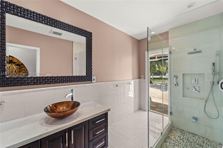 Waterfront Gem, on double guard gated (24/7) Belle Meade Island. Situated on a quiet cul-de-sac just one house from the wide bay - great Southern exposure + 125 linear feet on deep water and dock. Charming 4 bedroom house. Move in condition. Redone kitchen in 2014 overlooking a large pool patio and serene water views. Double car garage. Barrell tile roof and seawall are 9 years old. High impact glass doors and windows. Excellent location just minutes to Design District, Wynwood, Downtown, Miami and Beaches. Will not last - Real Sellers!