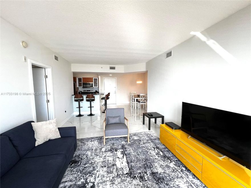 Its Appeal is Real! This delightful and immaculate 2Bed/2Bath TURNKEY condo is located in the heart of Aventura. The unit features beautiful ceramic tile flooring throughout and it is move-in ready. Enjoy peace of mind with impact windows and the convenience of an in-unit washer and dryer. Newer stainless steel appliances. Building with 24-hour security, valet, 3 infinity pools, a sauna, gym, clubroom, billiard room, a movie theater, and much more. Prime location within walking distance of supermarkets, stores, and restaurants. Near Aventura Mall, Hospital, and Beaches. Investor’s Paradise: NO RENTAL RESTRICTIONS (can be rented immediately & minimum 3 months). PET FRIENDLY!