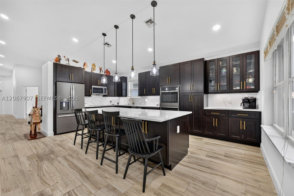 Photo of 10471 S Utopia Cir S, Boynton Beach, FL 33437 (MLS # A12067907)