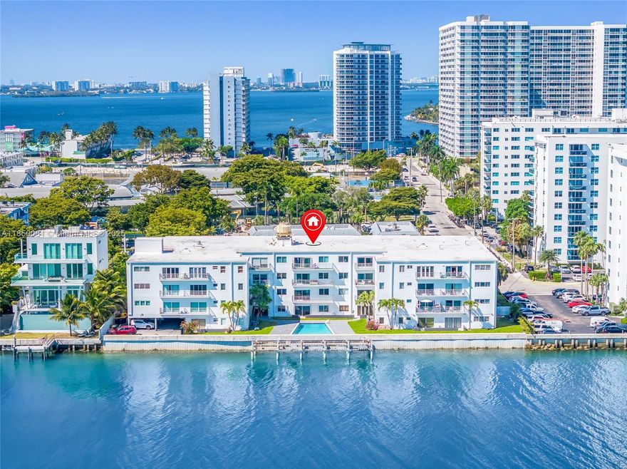 Welcome to this beautifully maintained, waterfront 2 bed / 2 bath condo located in the heart of North Bay Village. This spacious unit offers a desirable split floor plan that balances privacy and functionality, with laminate flooring throughout the main living areas and plush carpet in both bedrooms for added comfort. The spacious kitchen features modern appliances. Both bathrooms retain their original art deco charm with tile work that has been impeccably preserved. Step out onto your private balcony and take in stunning water views, perfect for morning coffee or evening sunsets. This unit also includes one assigned parking space for added convenience. Enjoy living just minutes from the beaches, Design District, Midtown, and Edgewater, with easy access to dining, shopping, and nightlife.