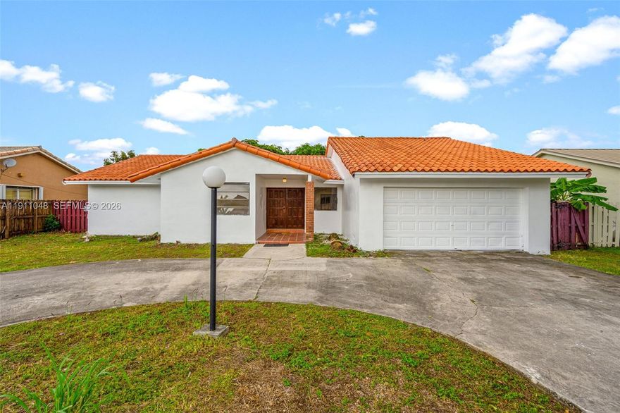 Updated single family home near Florida International University. This spacious 4 bed, 2 bath home sits on a large lot with plenty of room to park a boat or RV, offering the freedom and flexibility. The property features a 2 car garage plus a long driveway, providing ample parking for family and guests. Step inside to find new floors, updated bathrooms, and a newer A/C system, all designed for modern comfort and peace of mind. The open layout offers a bright and welcoming space perfect for entertaining or relaxing. Located just minutes from FIU, the Miami-Dade County Youth Fairgrounds, Tamiami Park, and major highways, this home combines location, convenience, and value. Photos have been virtually staged.