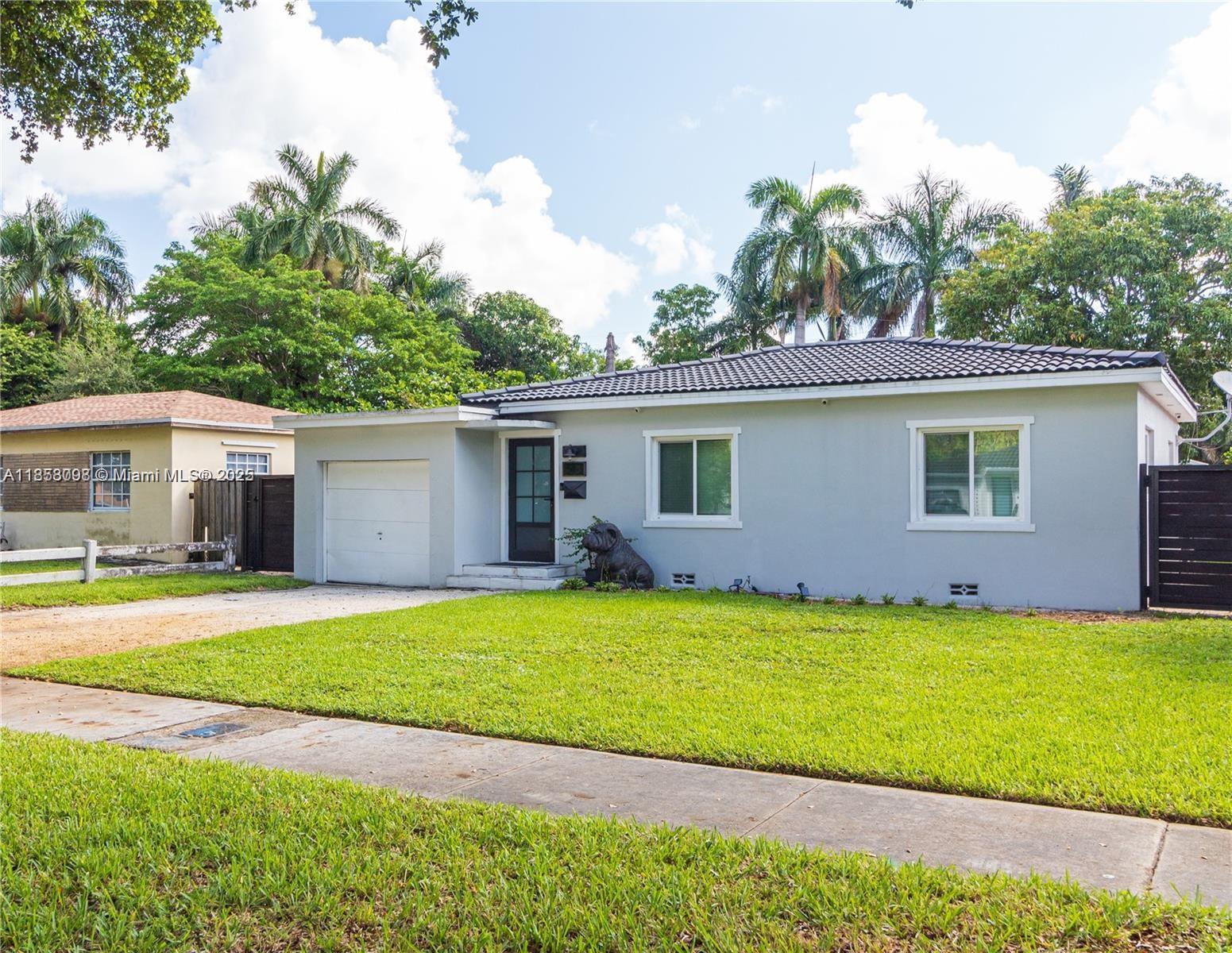 Beautifully updated 3-bed, 2-bath home in the heart of Miami Springs! Featuring impact windows & doors, a chef’s kitchen with wood cabinets, subway tile backsplash & marble countertops, plus elegant spotlights, updated baths, and sleek tile floors. One bedroom offers a private entrance—perfect for in-laws or guests. The garage conversion provides extra living space while still allowing storage. Enjoy an oversized backyard ideal for entertaining, kids, and pets. All just minutes from Miami International Airport, dining, and entertainment!